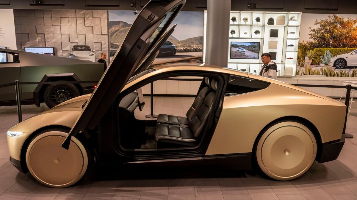 Musk ignored EV demand on Tesla's earnings call, touting Robotaxi and Optimus robot development instead.