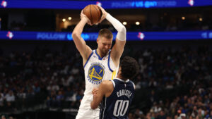 Moses Moody Sparks Warriors to Overtime Victory Against Mavericks Before Injury Exit